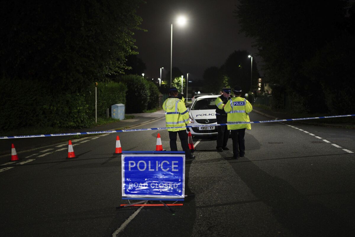 A police cordon on Royal Navy Avenue, near the scene of an incident in the Keyham area of Plymouth, southwest England, Thursday, Aug. 12, 2021. Police in southwest England said several people were killed, including the suspected shooter, in the city of Plymouth Thursday in a “serious firearms incident” that wasn't terror-related. (Ben Birchall/PA via AP)