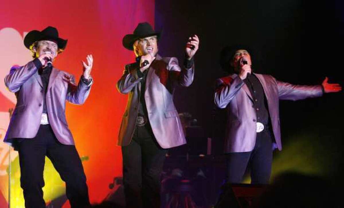 The Texas Tenors finish a song at the Lanterman Auditorium in La Canada Flintridge. The Texas Tenors performed gratis as part of a fundraiser for the Community Scholarship Foundation of La Canada Flintridge.
