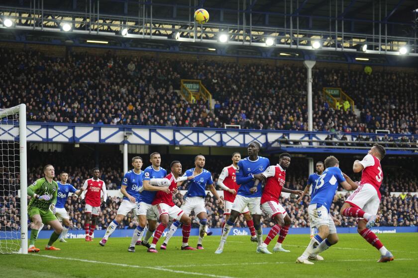 Arsenal and Everton players in action during the English Premier League soccer match.