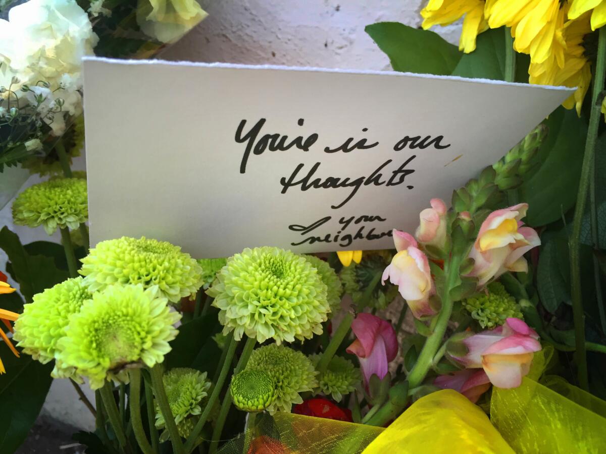 A neighbor's note left at a small memorial outside the Echo Park home where the body of Yonatan Daniel Aguilar was found.
