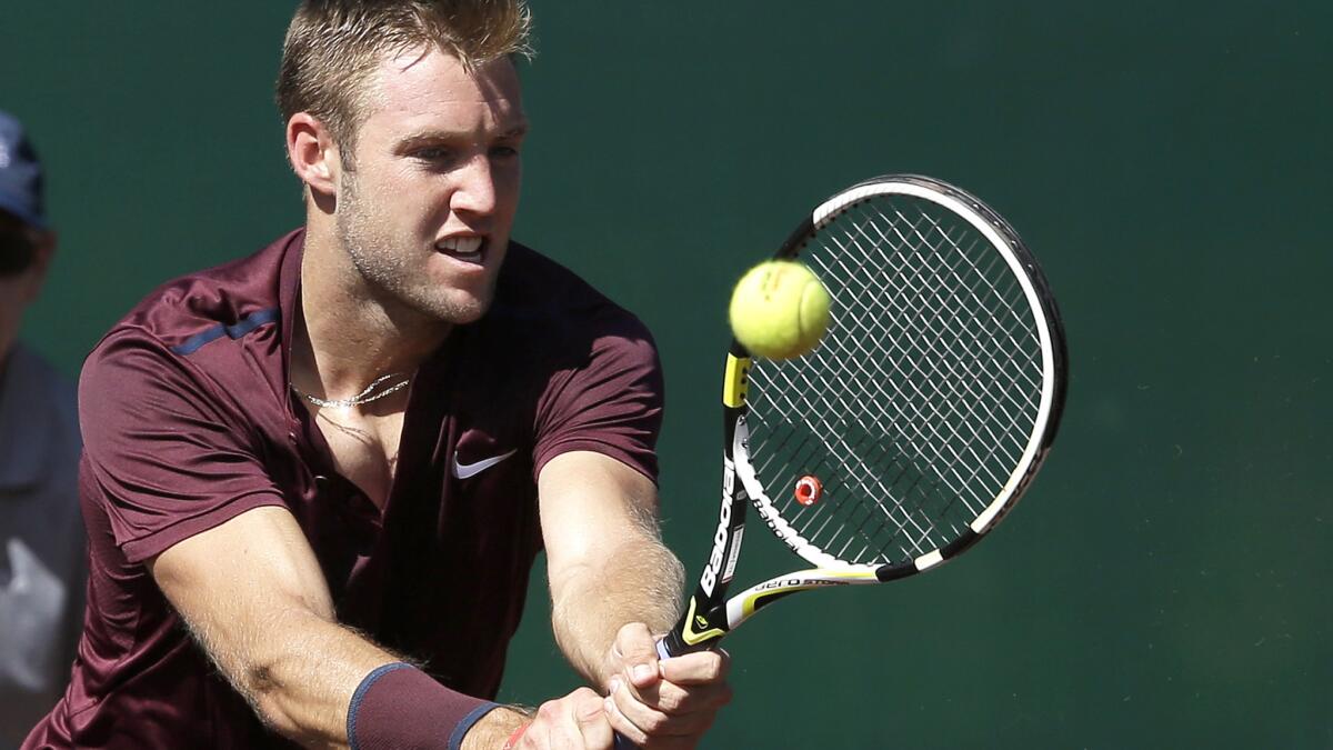 Jack Sock, shown returning a shot against Matthew Barton on Thursday, advanced to the U.S. Men's Clay Court Championship semifinals with a win Friday.