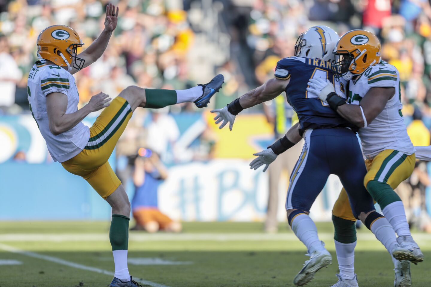 Chargers linebacker Drue Tranquill blocks a punt by the Packers' J.K. Scott.