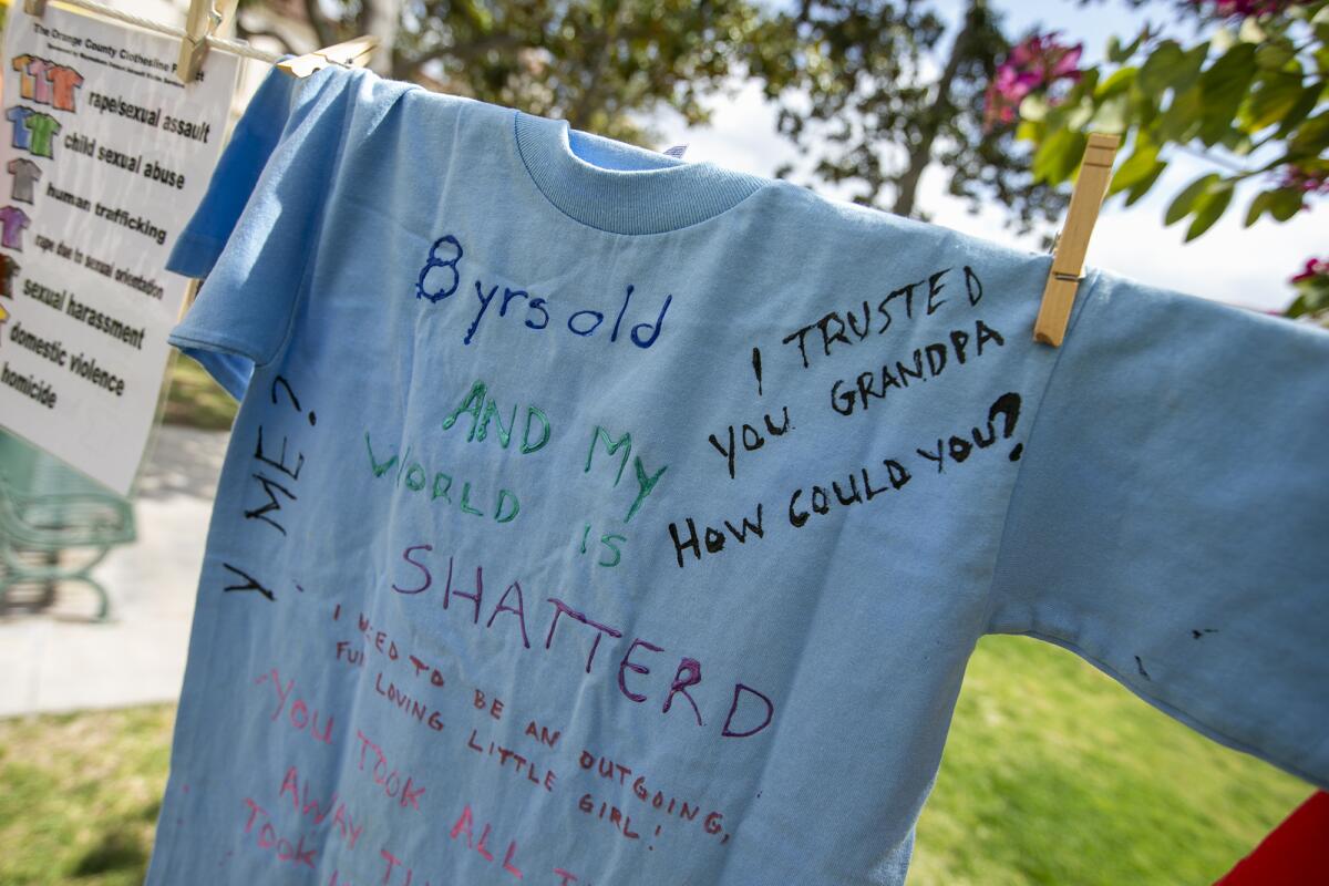 A T-shirt tells a story of child sexual abuse at the Waymakers' Clothesline Project at Fullerton College.