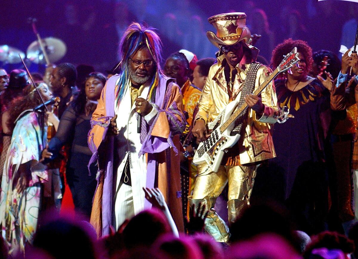 George Clinton, left, and bassist Bootsy Collins perform with Parliament Funkadelic at the 2004 Grammy Awards.