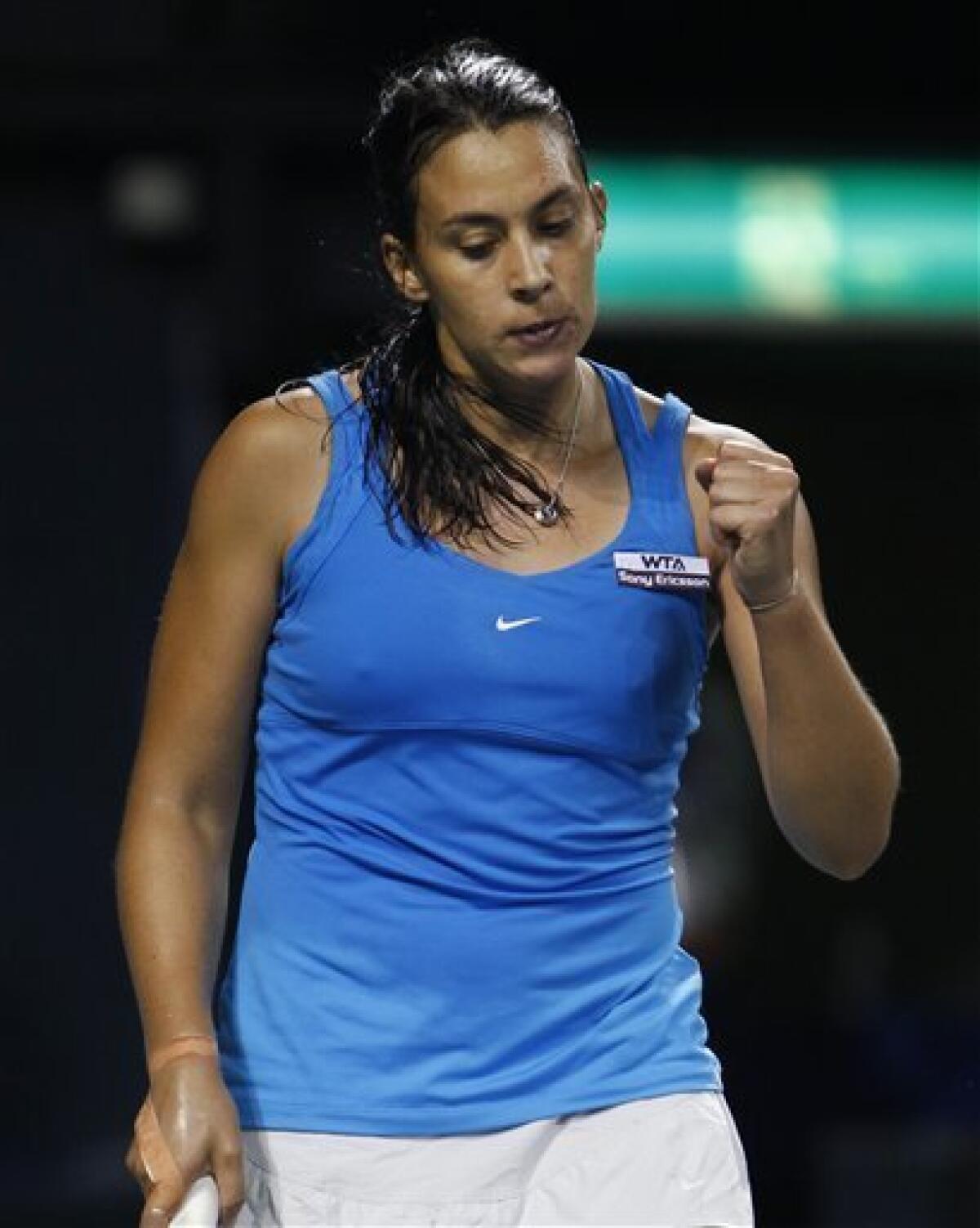 Marion Bartoli of France reacts after getting a point against Ayumi Morita of Japan during their second round match of during the Japan Pan Pacific Open tennis tournament in Tokyo, Monday, Sept. 26, 2011. Bartoli won 6-3, 0-6, 6-3. (AP Photo/Shizuo Kambayashi)