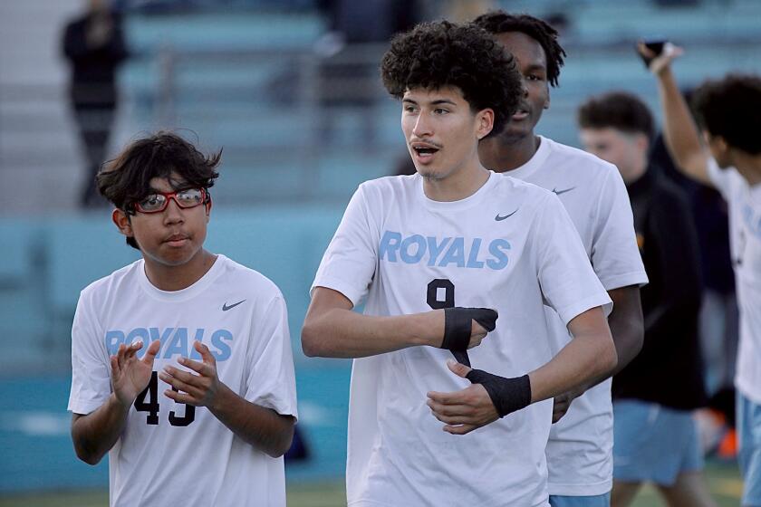 Senior forward Anthony Villa, center, scored both goals for El Camino Real in its 2-1 overtime victory against Palisades in the City Section Division I quarterfinals.