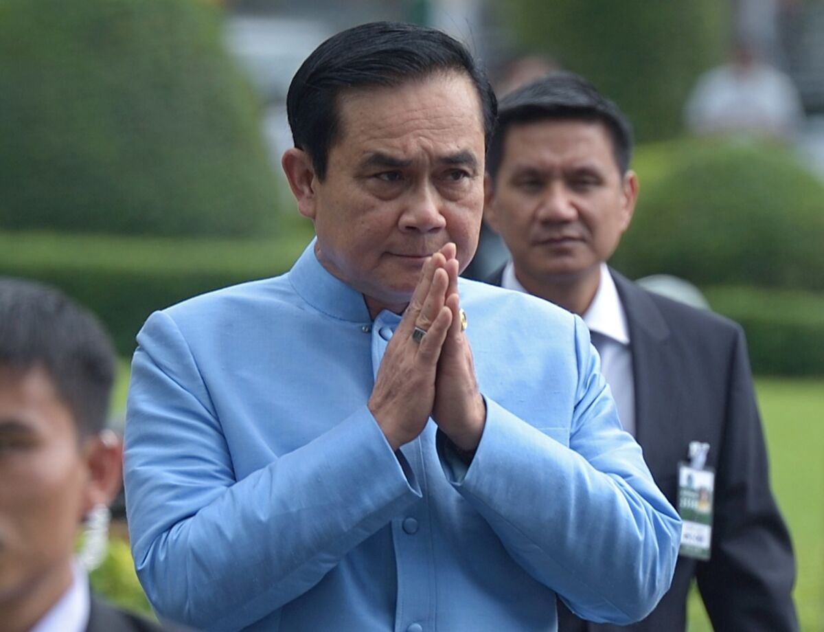 Thai prime minister and army chief Gen. Prayuth Chan-ocha gives a traditional greeting to the media before his first Cabinet meeting in Bangkok on Sept. 9.