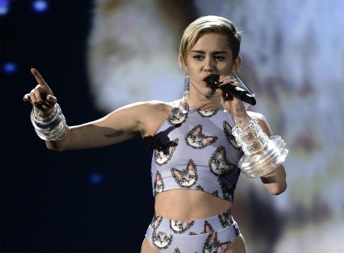 Miley Cyrus, cat lover? The young star gave "Wrecking Ball" a feline-friendly makeover.