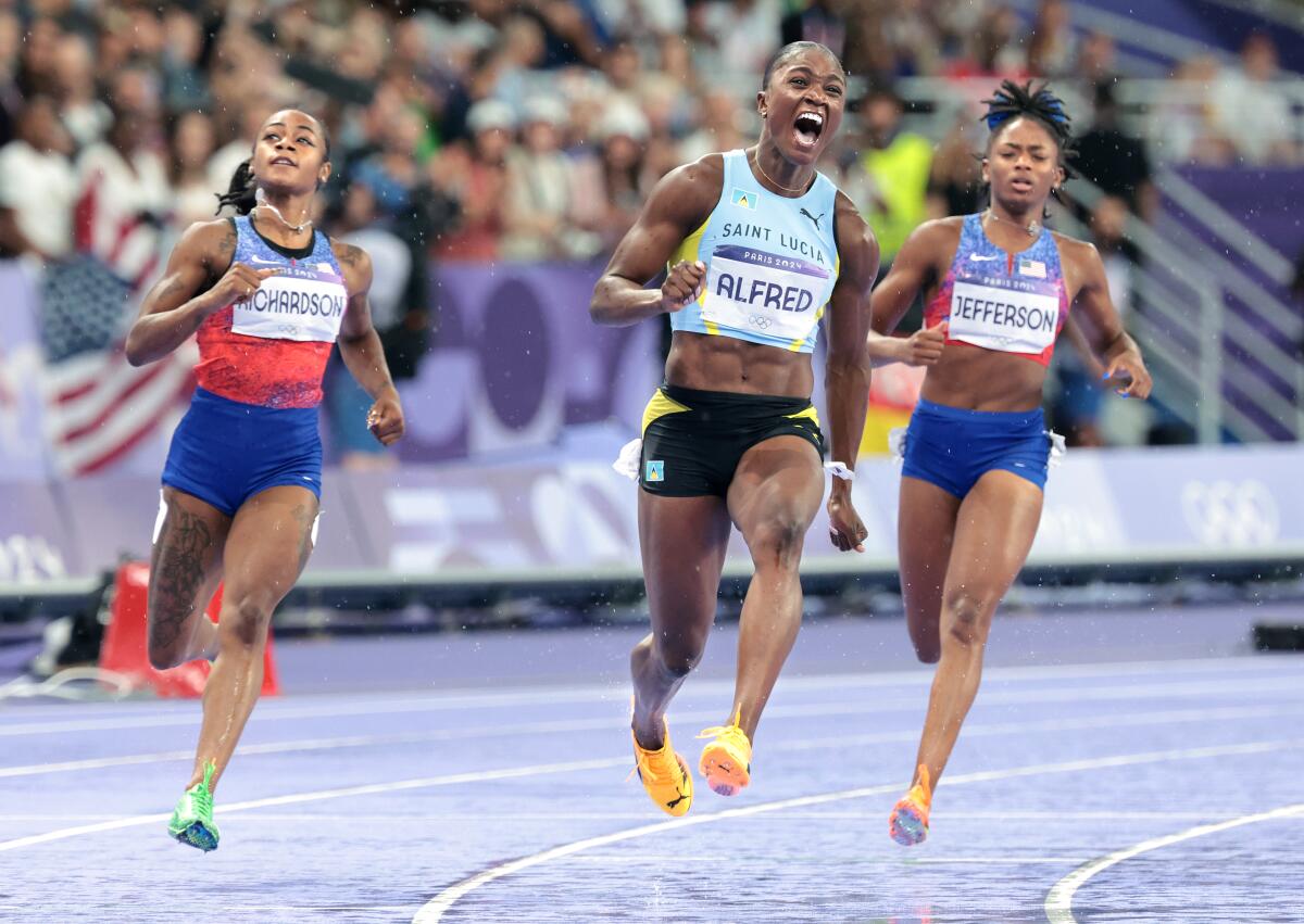 Saint Lucas's Julien Alfred, center, beats Americans Sha'carri Richardson, left, and Melissa Jefferson in the 100