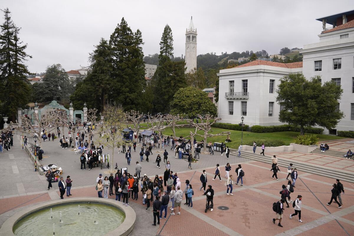 FILE - Students make their way through Sproul Plaza on the University of California, Berkeley, campus Tuesday, March 29, 2022, in Berkeley, Calif. Leaders of the University of California, Berkeley, denounced a protest incited Monday, Feb. 26, 2024, against an event organized by Jewish students that forced police to evacuate attendees and a speaker from Israel for their safety. (AP Photo/Eric Risberg, File)