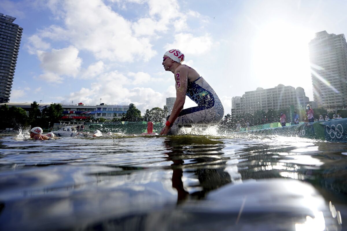 Haley Anderson, of the United States, jumps in the water at the start.