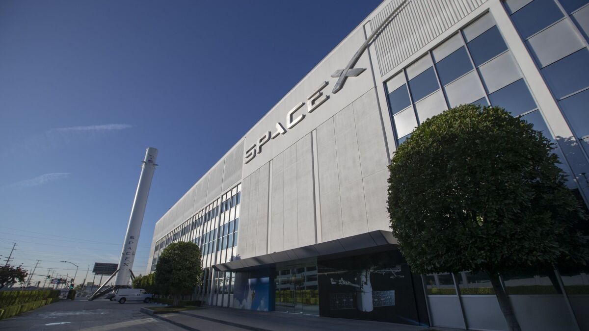 About 577 positions will be cut at SpaceX's headquarters in Hawthorne, Calif., an official said Sunday.
