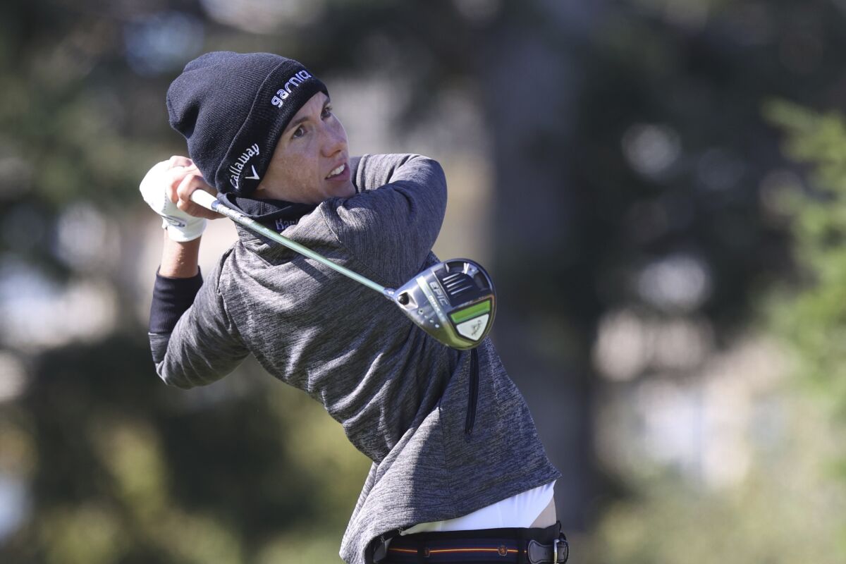 Carlota Ciganda, of Spain, watches her tee shot on the second hole during the first round of the LPGA Cambia Portland Classic golf tournament in Portland, Ore., Thursday, Sept. 16, 2021. (AP Photo/Steve Dipaola)