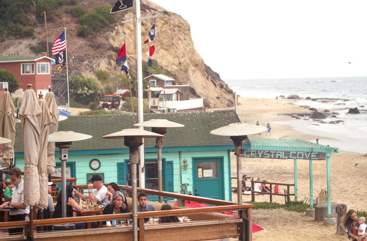 Patrons dine with an ocean view at the Beachcomber Cafe at Crystal Cove State Beach.