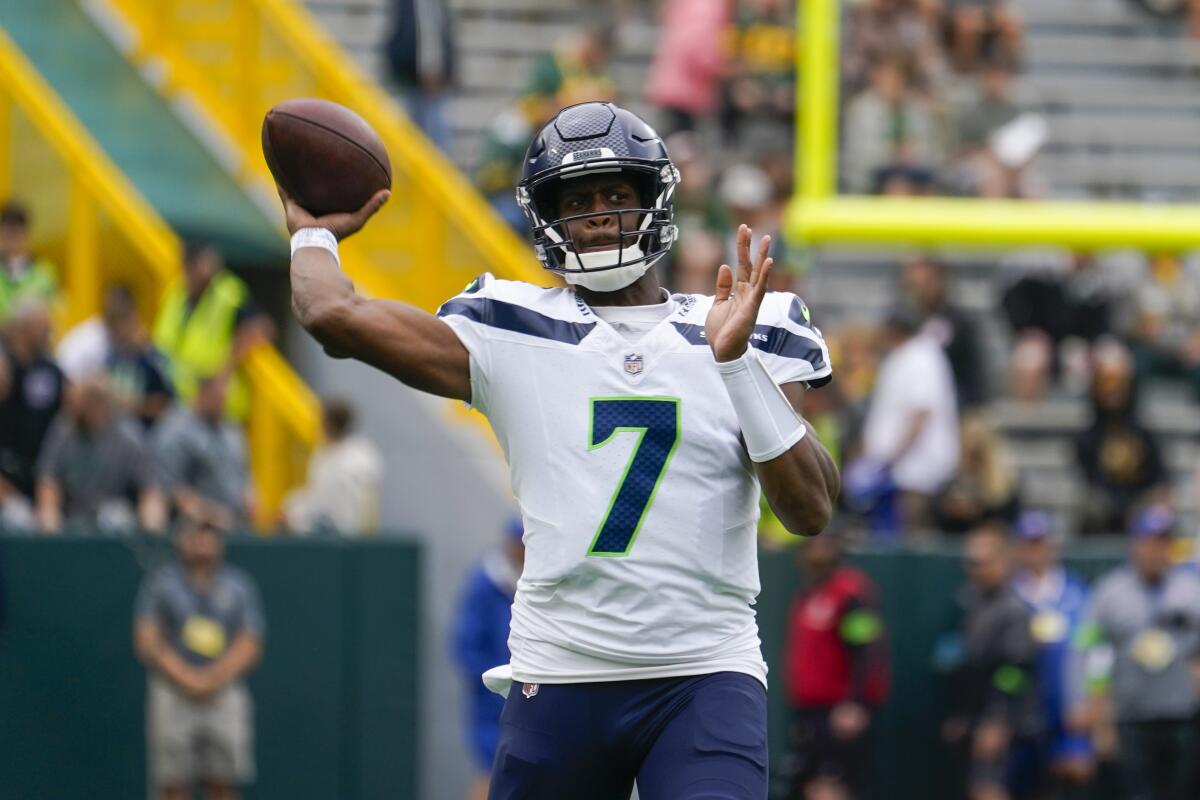 Seattle Seahawks quarterback Geno Smith warms up before a preseason game.