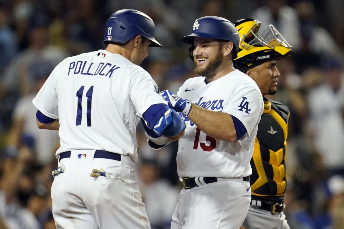 Dodgers' Max Muncy celebrates his three-run home run with AJ Pollock.