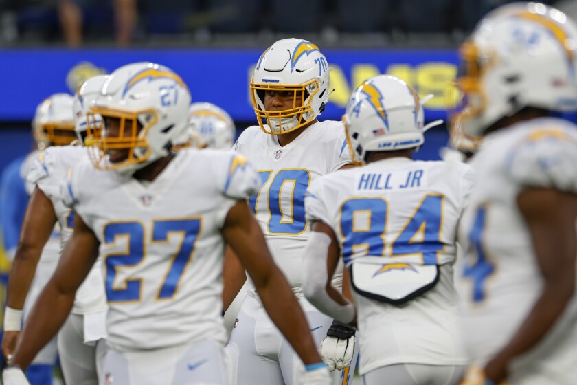 Chargers offensive tackle Rashawn Slater warms up before a preseason game against the Rams on Aug. 14.