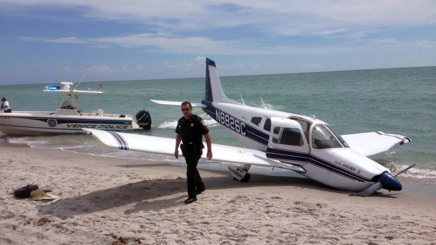 The Piper Cherokee's nose is down in the sand after the landing that ended in tragedy for Florida tourists.