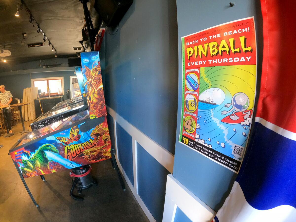 A poster advertising the pinball contest at Cruisers Pizza Bar Grill and Brewcades.
