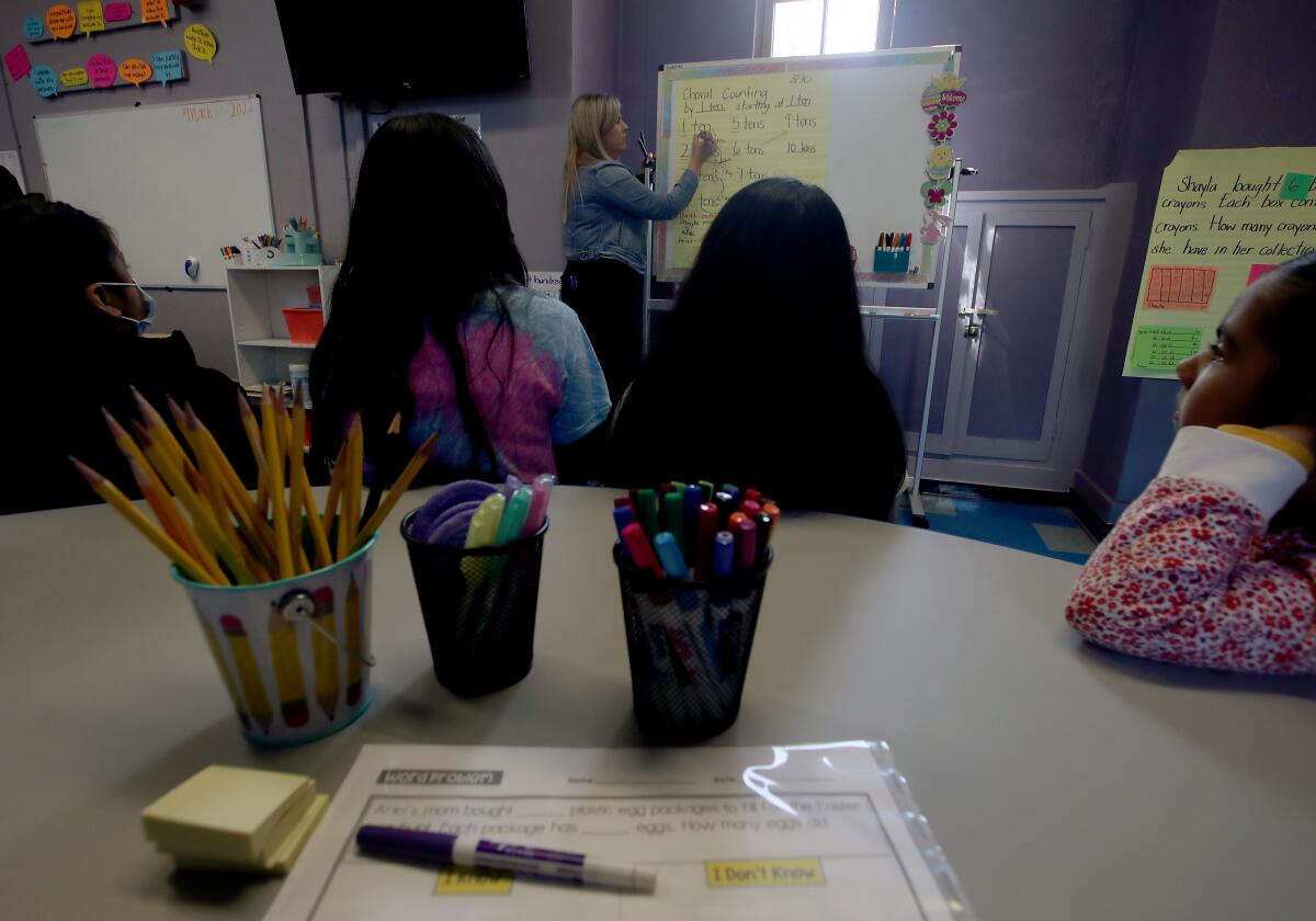 Yesenia Gutierrez instructs students in a classroom