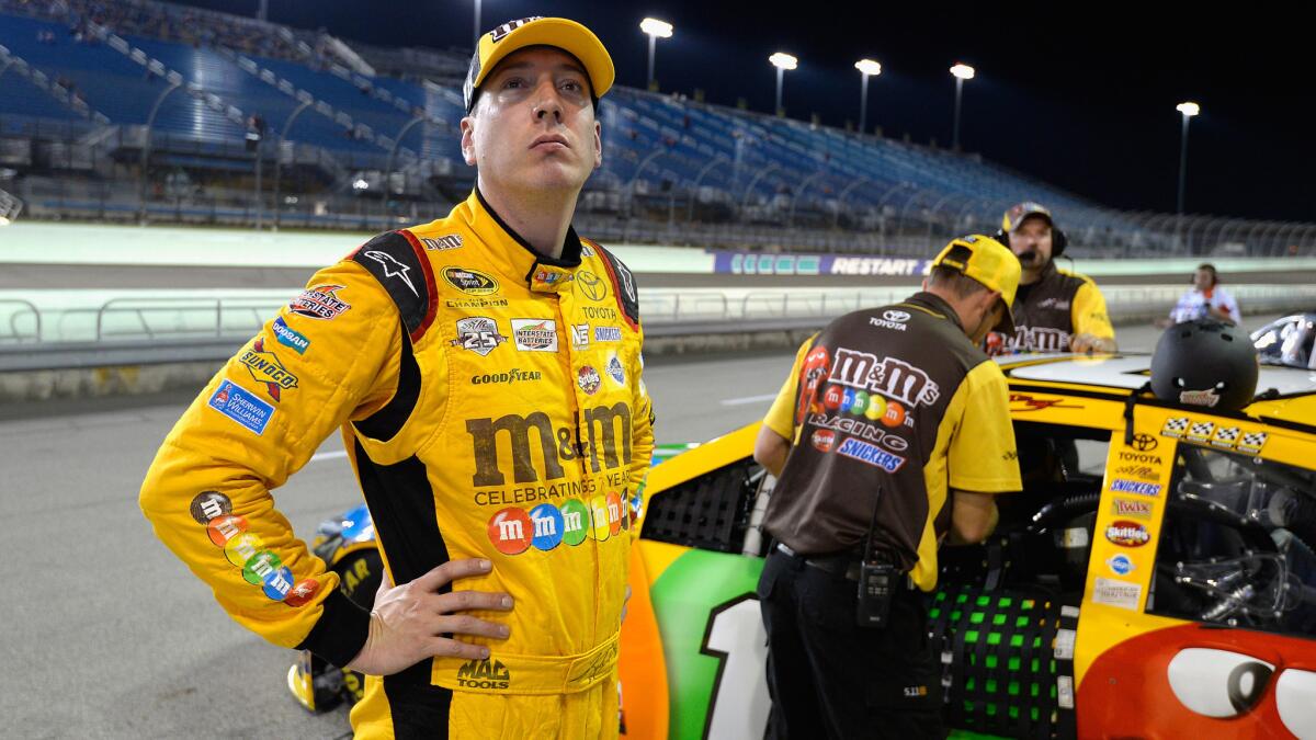 NASCAR driver Kyle Busch stands on the grid at Homestead-Miami Speedway on Friday during qualifying for Sunday's Sprint Cup season finale.