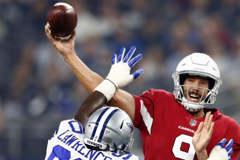 Mandatory Credit: Photo by LARRY W SMITH/EPA-EFE/REX/Shutterstock (9808663f) Arizona Cardinals quarterback Sam Bradford (R) passes the ball against the Dallas Cowboys in the first half of the NFL pre-season American football game between the Arizona Cardinals and Dallas Cowboys at AT&T Stadium in Arlington, Texas, USA, 26 August 2018. Arizona Cardinals at Dallas Cowboys, Arlington, USA - 26 Aug 2018 ** Usable by LA, CT and MoD ONLY **