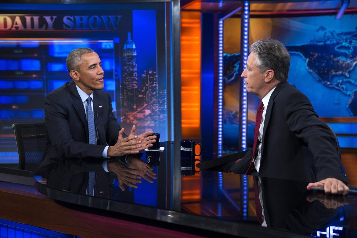 President Obama, left, talks with Jon Stewart, host of "The Daily Show," during a taping Tuesday in New York. The president used his appearance to aggressively promote the nuclear deal with Iran.