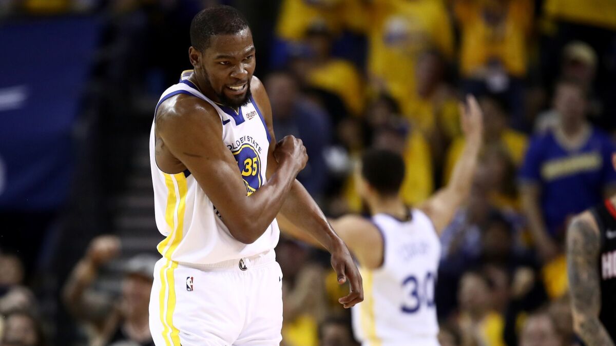Golden State's Kevin Durant reacts after the Warriors scored a basket against the Houston Rockets during Game 5 of the Western Conference semifinals on May 8.