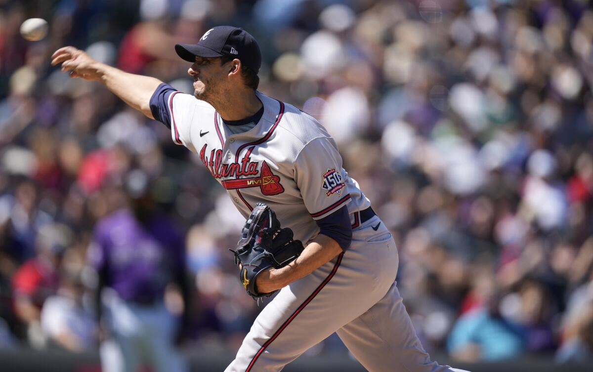 Atlanta Braves starting pitcher Charlie Morton works against the Colorado Rockies in the first inning of a baseball game Sunday, Sept. 5, 2021, in Denver. (AP Photo/David Zalubowski)