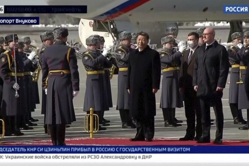In this grab taken from video provided by RU-24, China's President Xi Jinping stands, during an official welcome ceremony upon his arrival at the Vnukovo-2 government airport outside Moscow, Monday, March 20, 2023. (RU- 24 via AP)