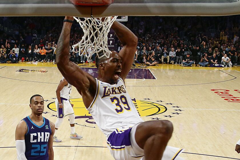 Lakers center Dwight Howard slam dunks during the second half of a 120-101 victory over the Charlotte Hornets at Staples Center on Oct. 27, 2019.