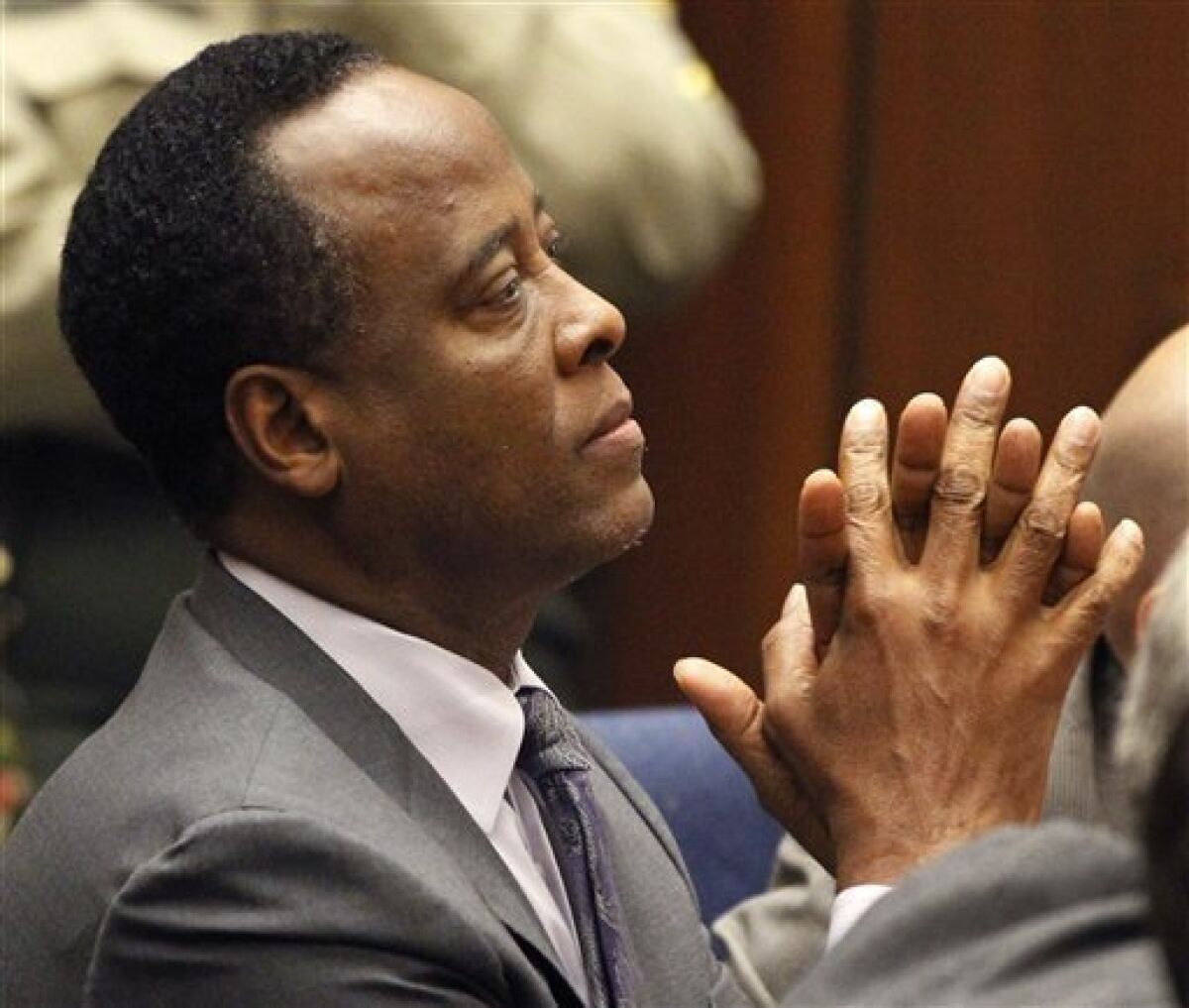 Dr. Conrad Murray sits in court after he was sentenced to four years in county jail for his involuntary manslaughter conviction in the death of pop star Michael Jackson on Tuesday, Nov. 29, 2011 in Superior Court in Los Angeles. (AP Photo/Mario Anzuoni, Pool)