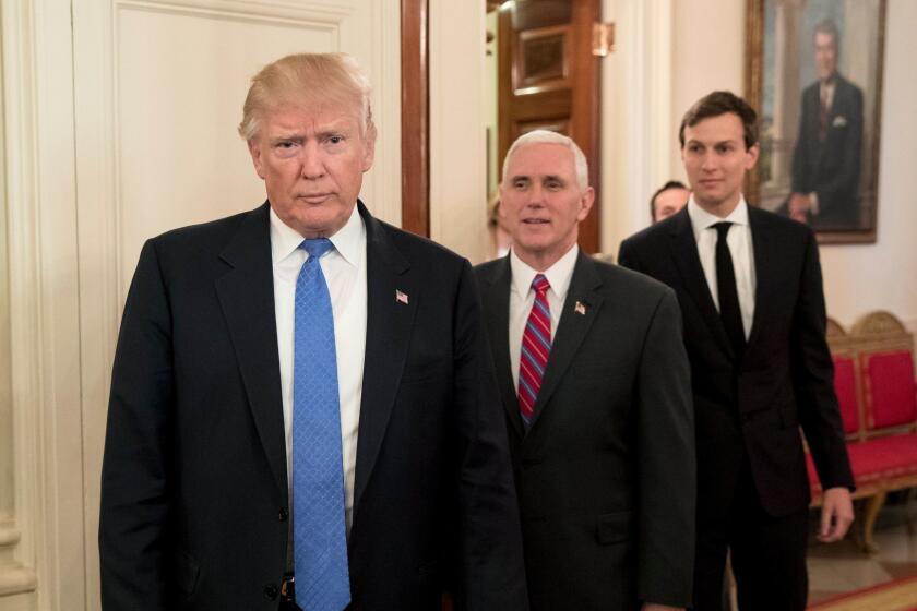 Donald Trump, Vice President Mike Pence, and Senior Advisor to President Trump Jared Kushner enter the State Dining Room, in front of an oil portrait of former U.S. President Ronald Reagan.