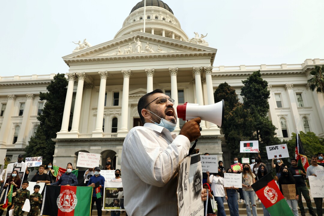 A man speaks into a bullhorn