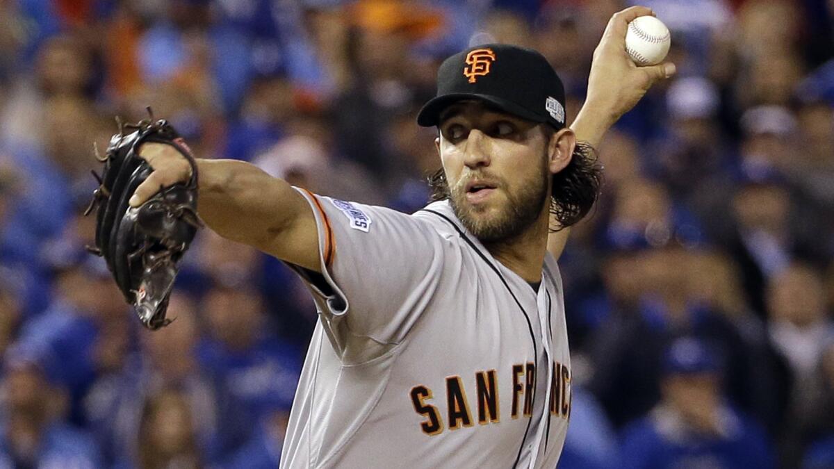 San Francisco Giants starter Madison Bumgarner delivers a pitch during Game 7 of the World Series on Oct. 29. Bumgarner and the Giants are aiming to capture their fourth World Series title in six years in 2015.