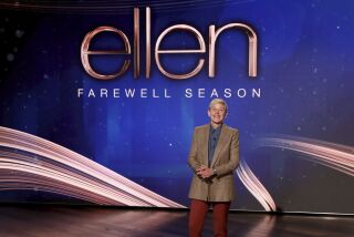 A talk show host appears onstage in front of a screen that says 'Ellen Farewel Season'