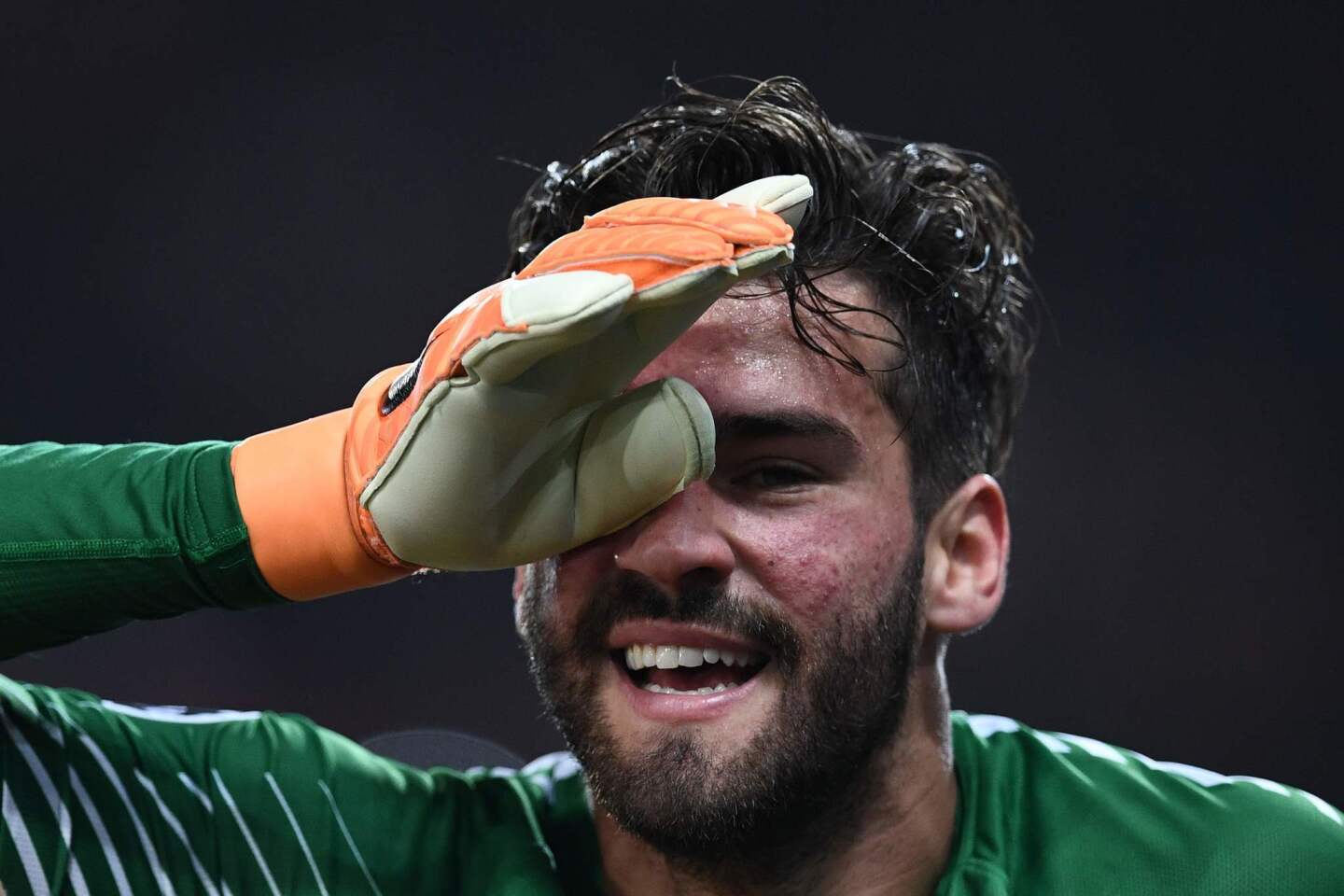 AS Roma's Brazilian goalkeeper Alisson Becker celebrates his team's victory at the end of the UEFA Champions League quarter-final second leg football match between AS Roma and FC Barcelona at the Olympic Stadium in Rome on April 10, 2018.