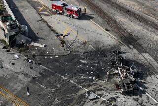 Wilmington, CA - February 15: Aerial view of a Los Angeles Fire Dept. firefighter and truck at the scene of a truck explosion where several firefighters were injured, at least two critically, in an explosion involving a truck with pressurized cylinders in Wilmington Thursday, Feb. 15, 2024. Firefighters were sent to the 1100 block of North Alameda Street shortly before 7 a.m., according to Nicholas Prange of the Los Angeles Fire Department. ``Several other injured are being evaluated on scene, awaiting additional ambulances to arrive -- (an) estimated seven total firefighters,'' Prange said.(Allen J. Schaben / Los Angeles Times)