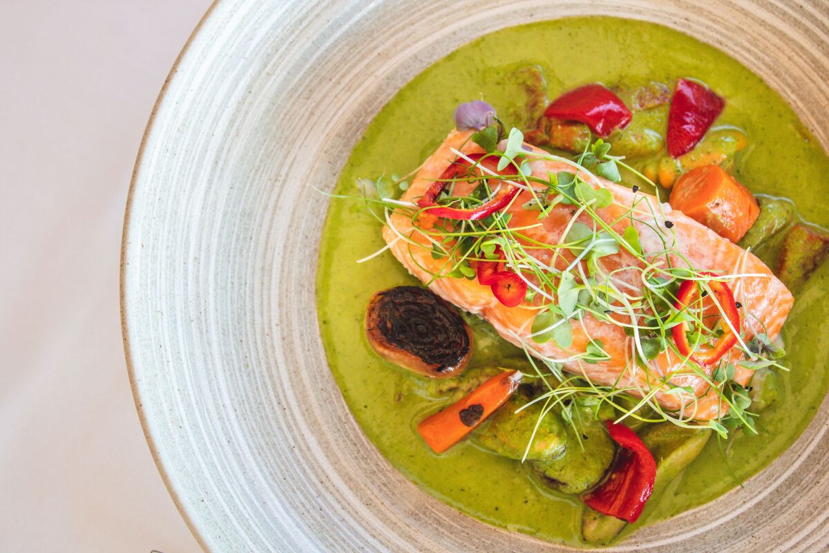 The spectacular pan roasted salmon in spicy green curry broth is one of the $40 dinner menu choices at Island Prime during Restaurant Week.