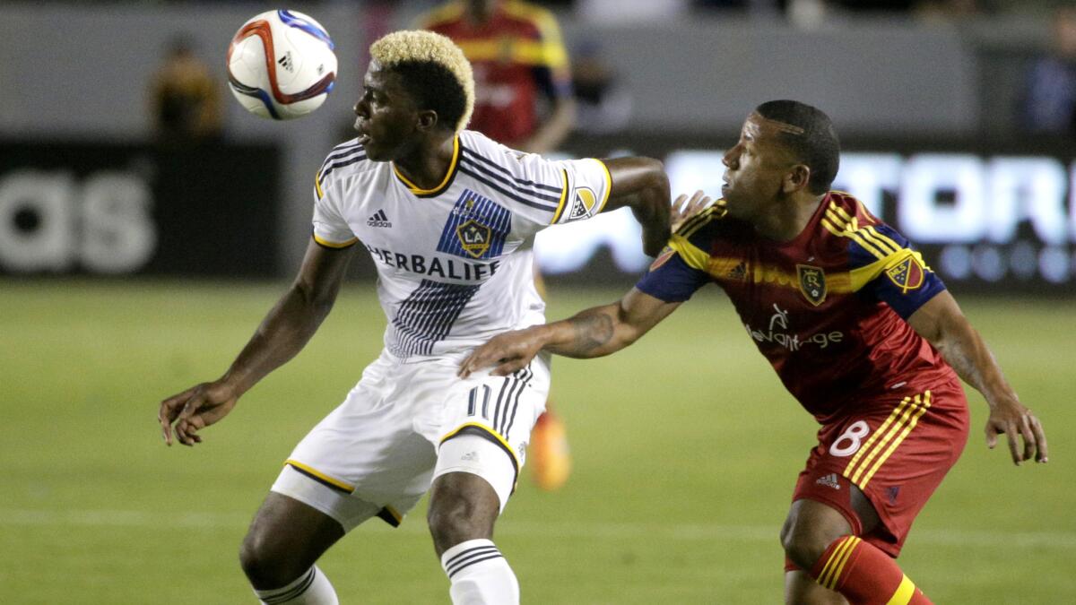 Galaxy forward Gyasi Zardes, left, controls the ball against Real Salt Lake's Joao Plata during the second half of a game May 27 at StubHub Center.