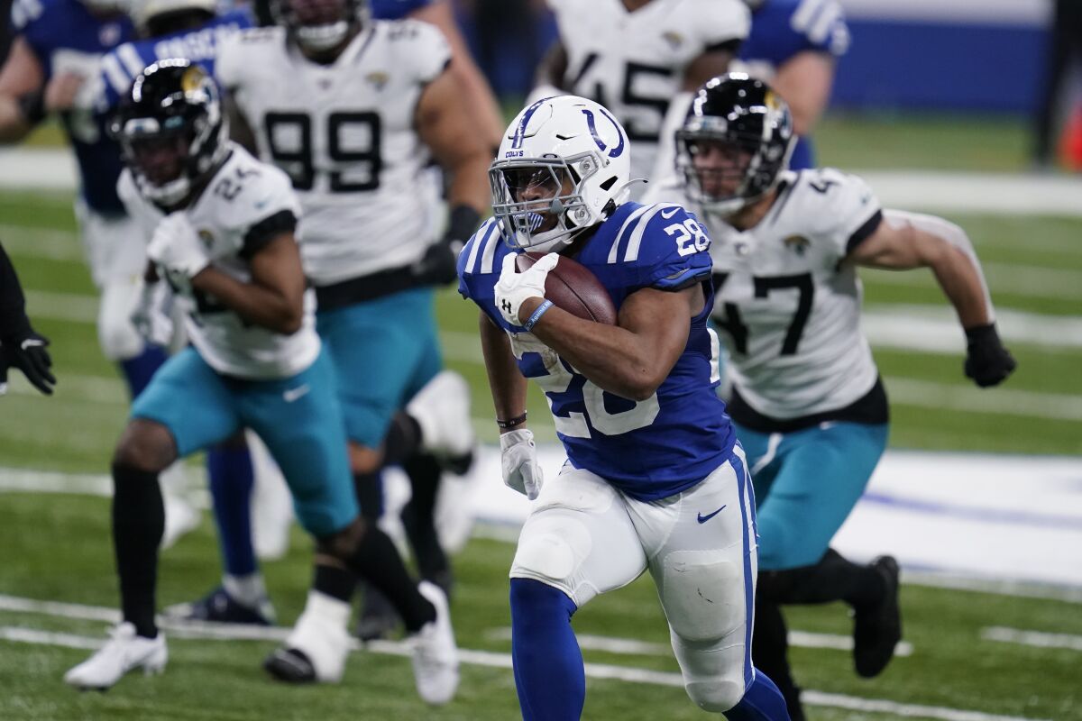 Indianapolis Colts running back Jonathan Taylor runs for a touchdown against the Jacksonville Jaguars.