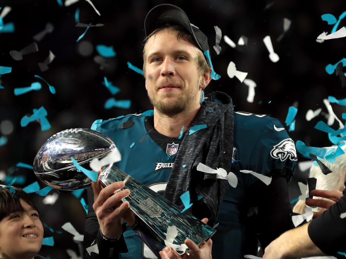 Nick Foles #9 of the Philadelphia Eagles celebrates with the Lombardi Trophy after defeating the New England Patriots 41-33 in Super Bowl LII at U.S. Bank Stadium on February 4, 2018 in Minneapolis, Minnesota.