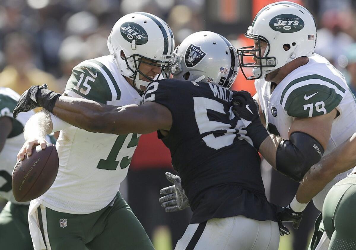 Raiders defensive end Khalil Mack sacks Jets quarterback Josh McCown in Oakland on Sept. 17.