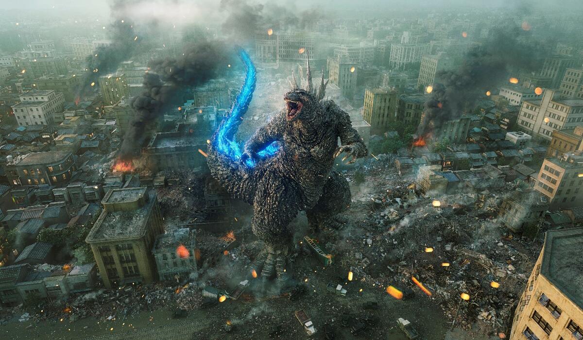 Godzilla, with a bright blue tail, rampages through Tokyo in "Godzilla Minus One."