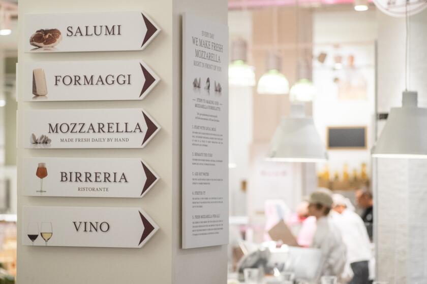 Signs point to a few of the specialty areas at the Chicago Eataly.