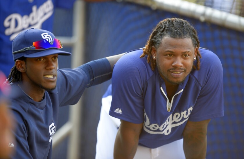 Hanley Ramirez talks with San Diego's Cameron Maybin, left, during batting practice on Wednesday. Ramirez is expected to be activated off the disabled list Sunday.