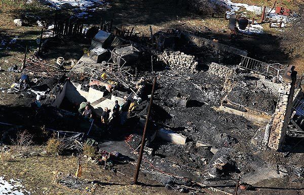 Investigators have found personal items of fugitive ex-police officer Christopher Dorner inside the rubble of the burned cabin where they found human remains, those in law enforcement with knowledge of the case said.