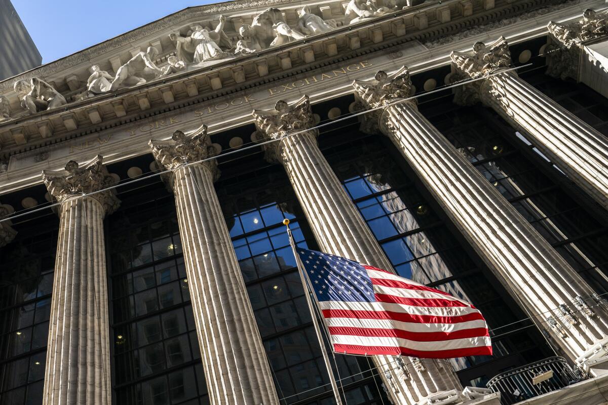 A U.S. flag waves outside the New York Stock Exchange
