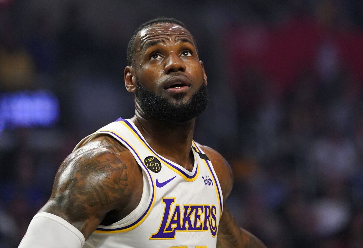 Lakers forward LeBron James watches for a rebound.