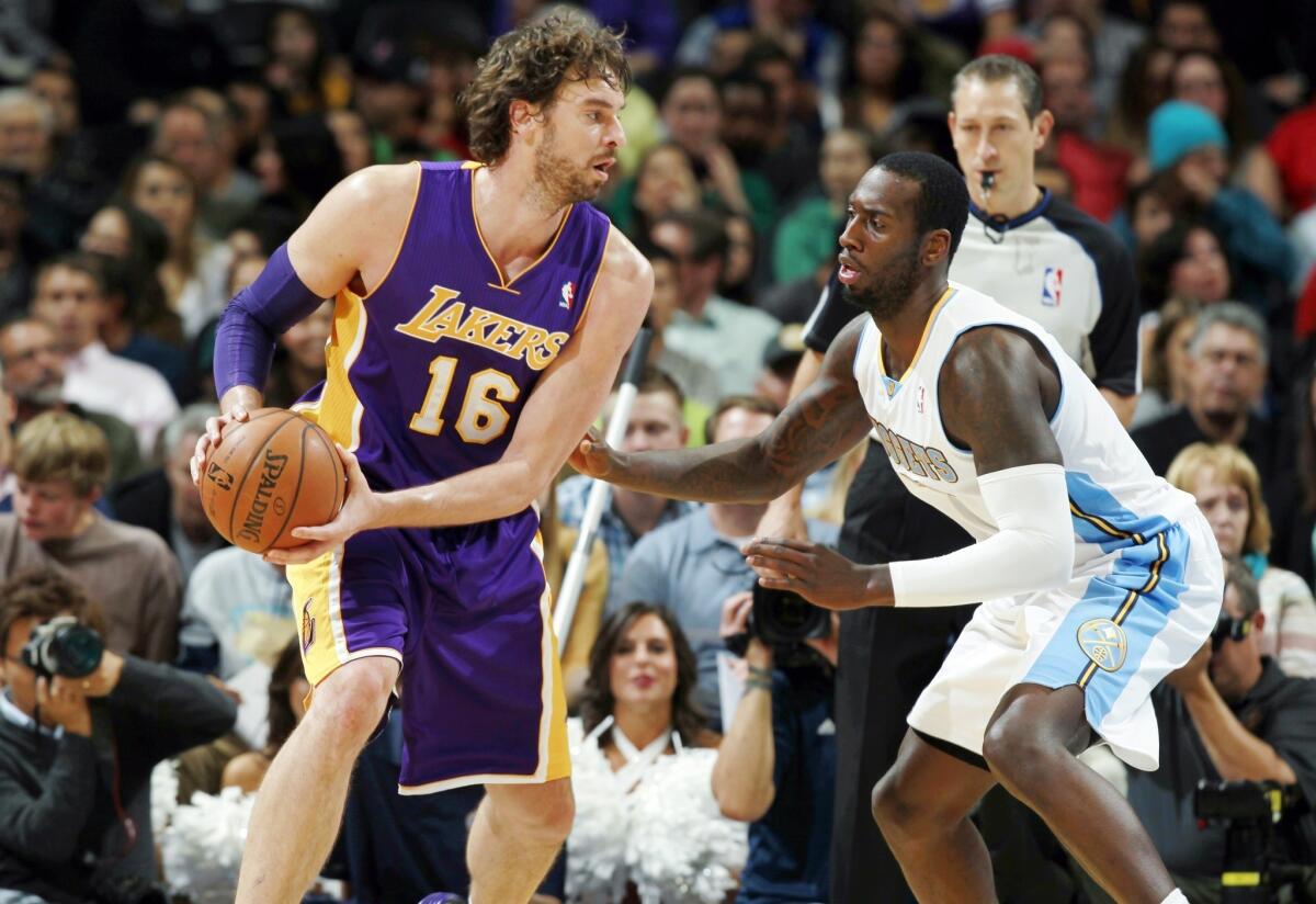 Lakers forward Pau Gasol, left, tries to work inside on Denver Nuggets forward J.J. Hickson during the Lakers' 111-99 loss Wednesday. The Lakers have struggled in the second game of back-to-back contests.